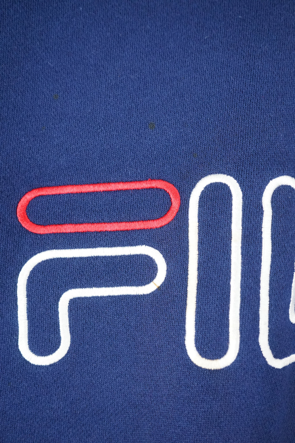 Navy blue sweatshirt with Fila logo on a white background