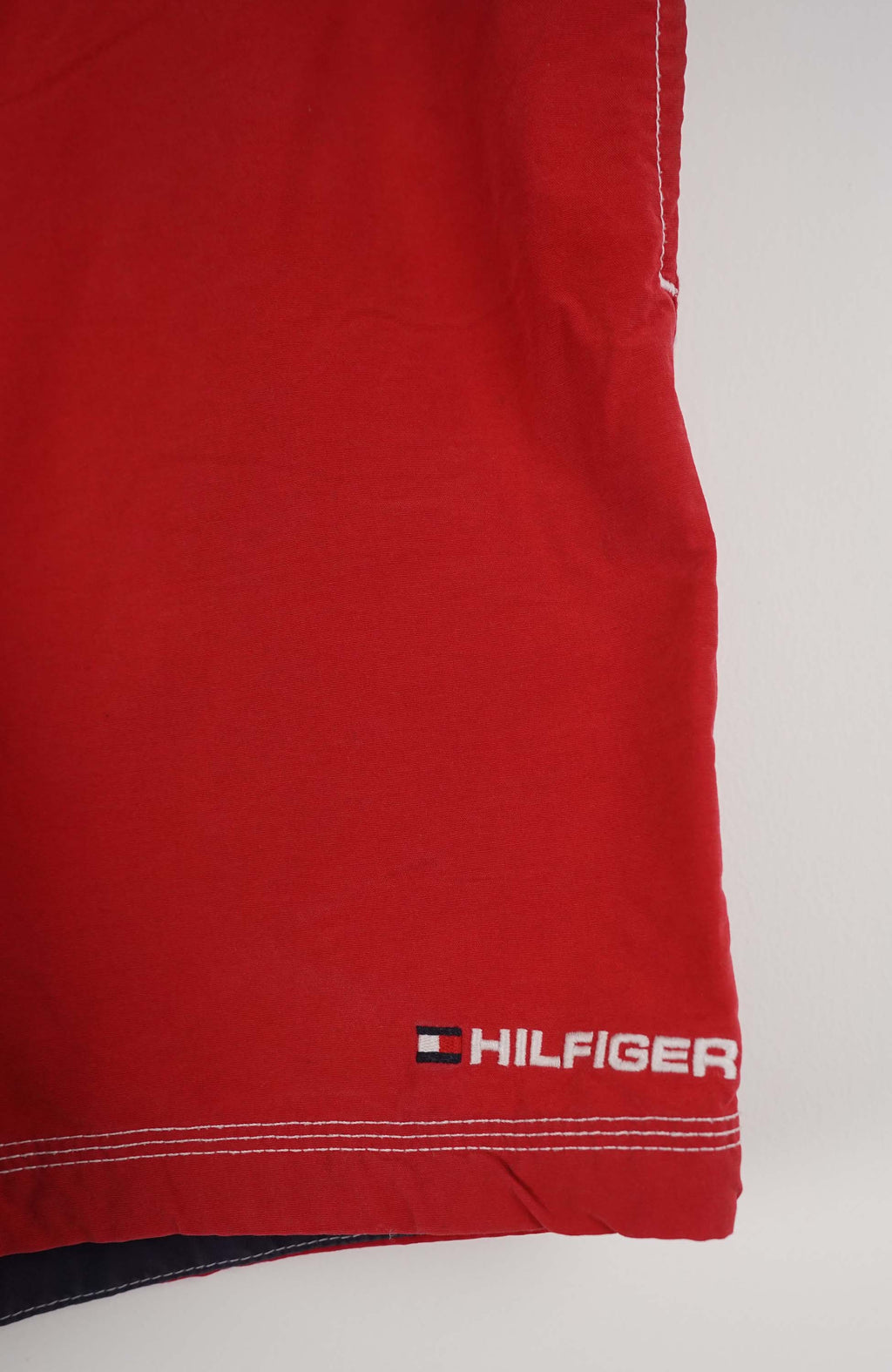 Red shorts with a brand logo on a white background