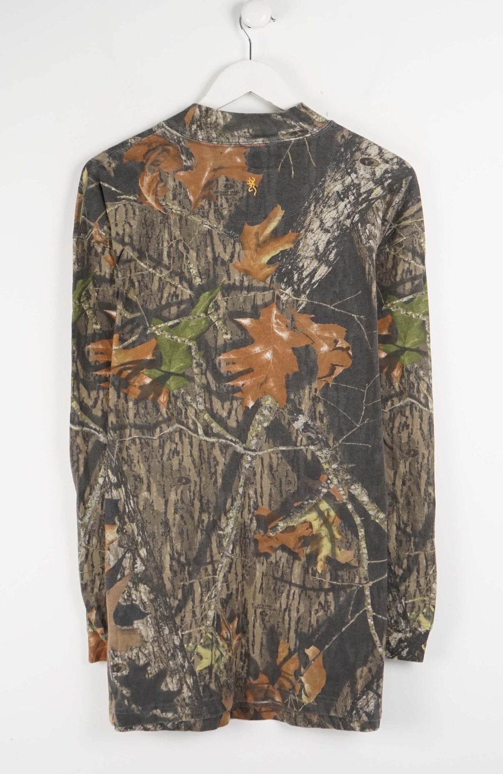 Camouflage-patterned long-sleeve shirt on a white hanger