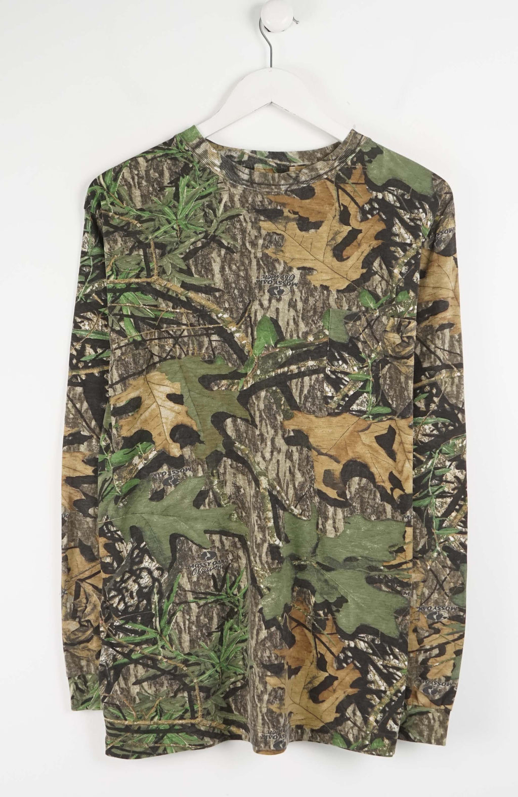 Camouflage long-sleeve shirt on a white background