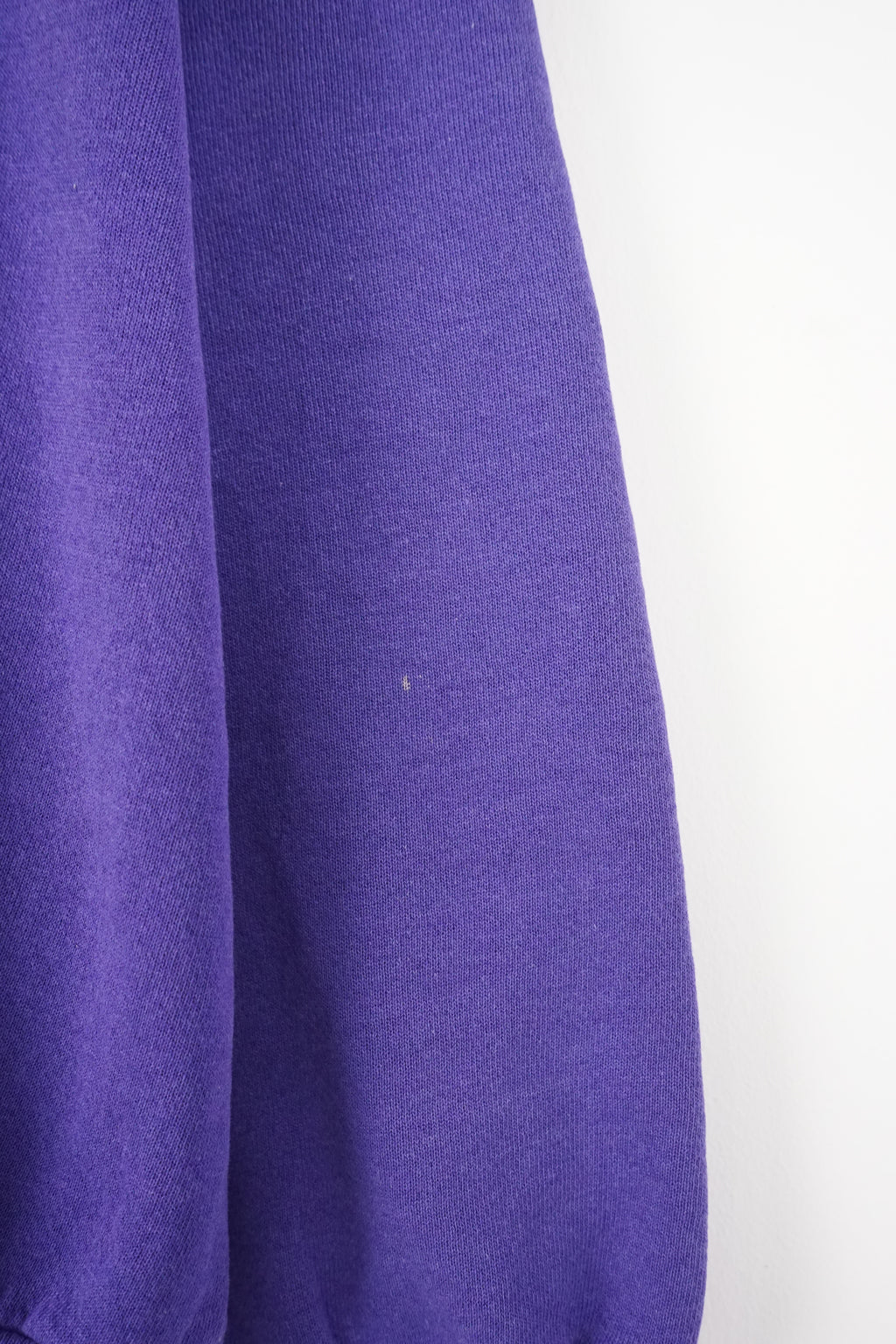 Purple sweatshirt with 'Vikings' text on a white background