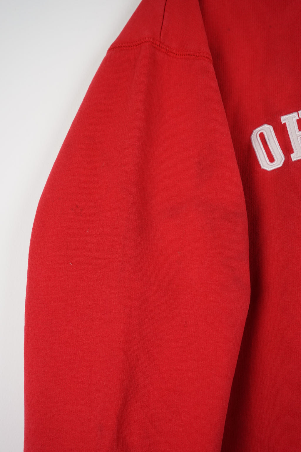 Red Ohio State sweatshirt on a white hanger