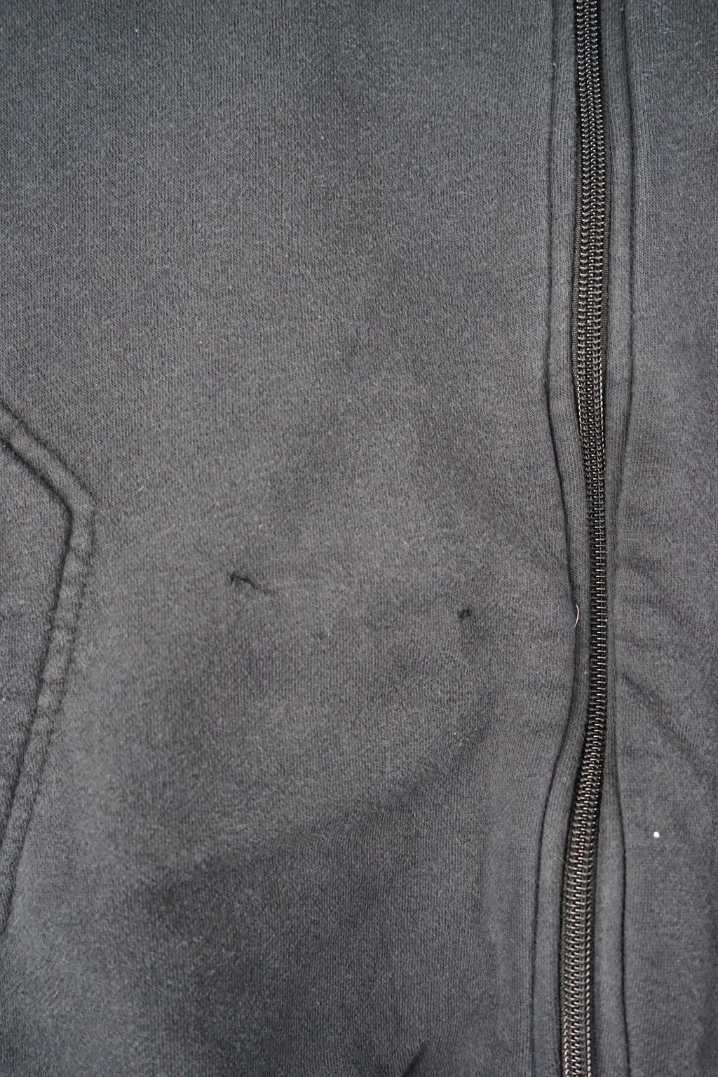 Black zip-up sweatshirt with a Nike logo on a white background