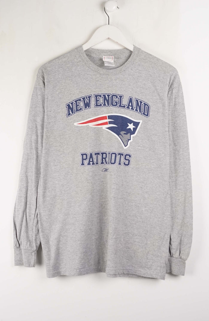 Gray long-sleeve shirt with New England Patriots logo on a white background