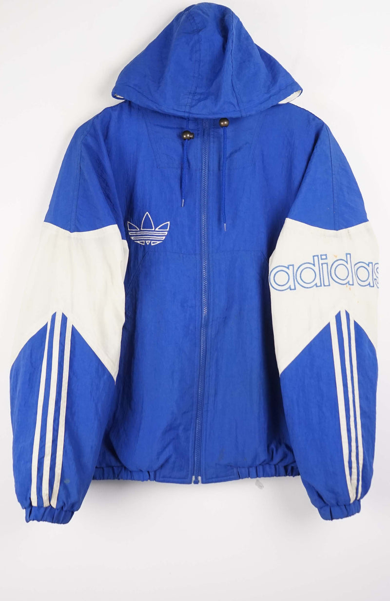 Blue and white Adidas jacket with brand logos on a white background