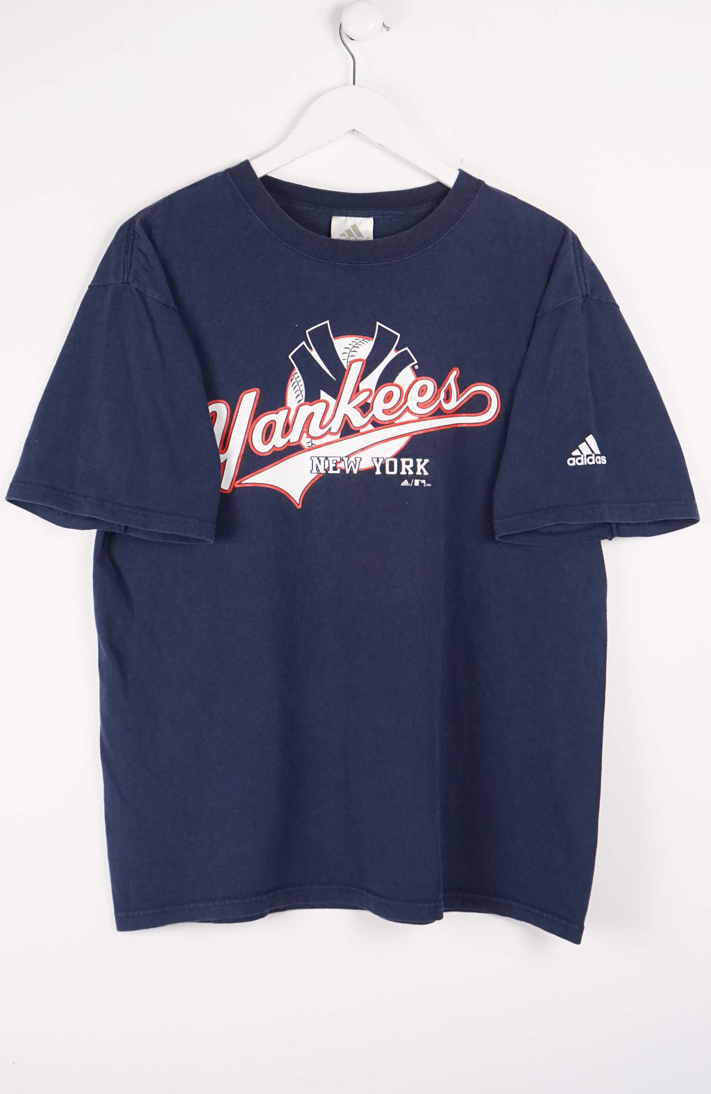 Navy blue t-shirt with New York Yankees logo on a white background