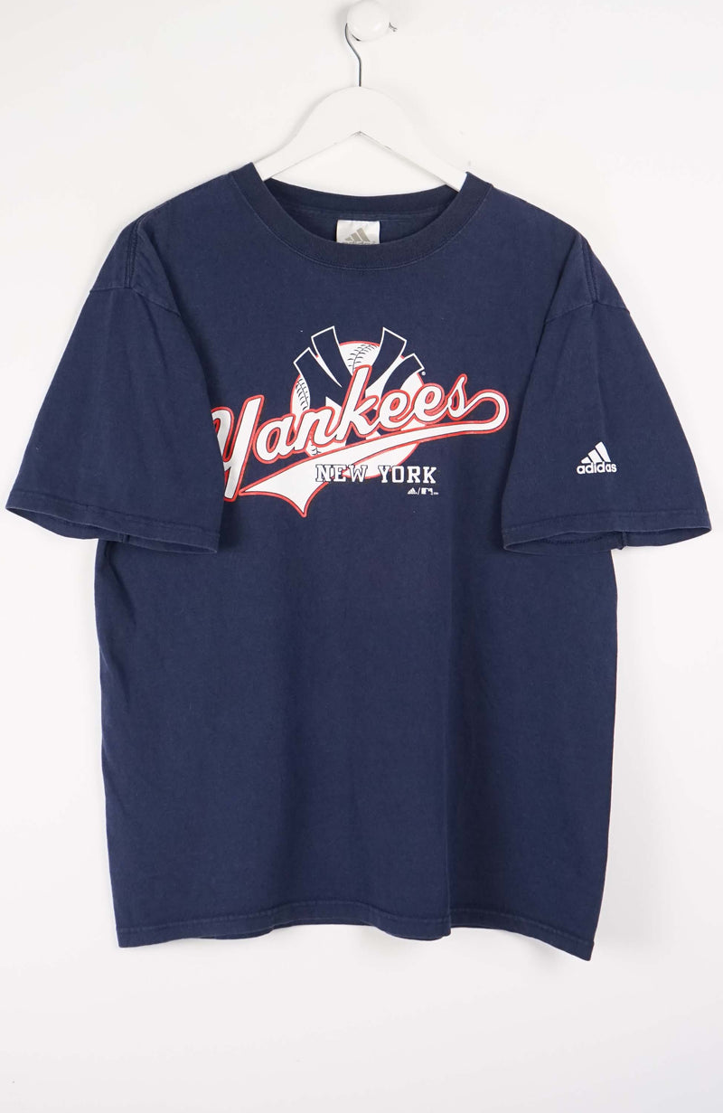 Navy blue t-shirt with New York Yankees logo on a white background