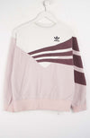 Pink Adidas sweatshirt with white stripes on a white background