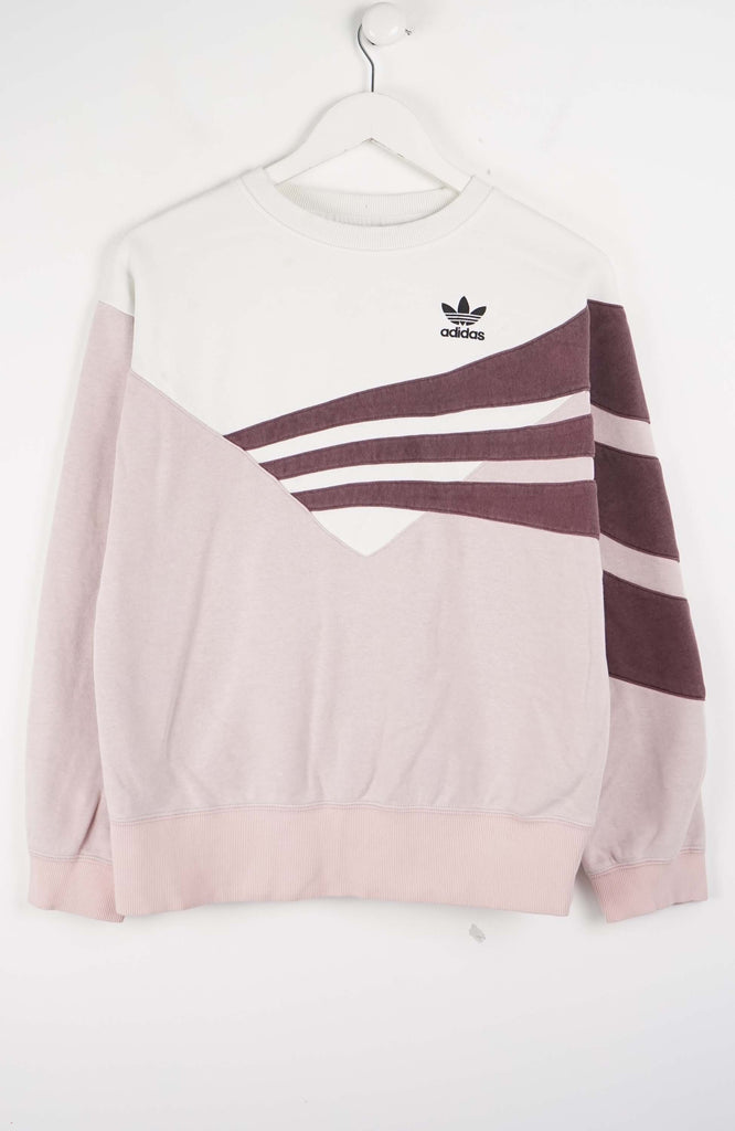 Pink Adidas sweatshirt with white stripes on a white background