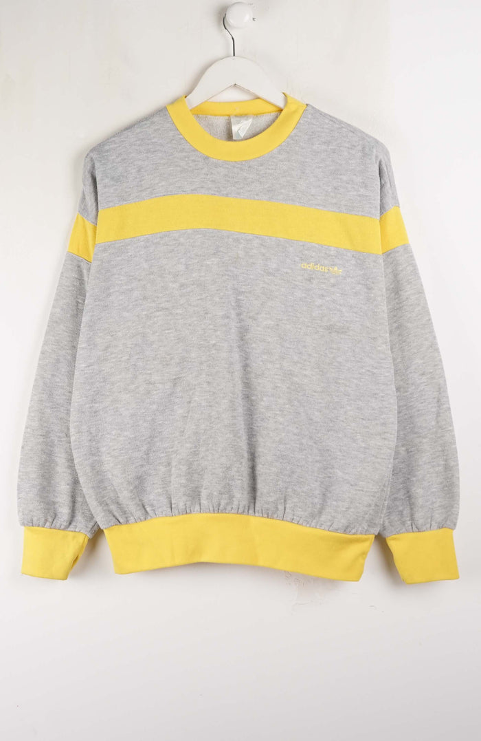 Gray sweatshirt with yellow accents on a white background