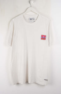 White t-shirt with Adidas logos on a white background