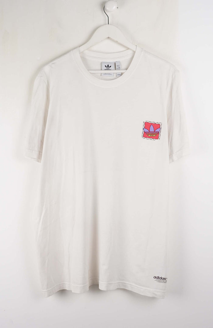 White t-shirt with Adidas logos on a white background
