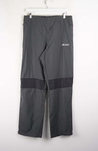 Gray pants with a small logo on a white background