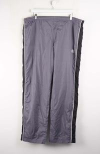 Gray tracksuit pants with black stripes on a white background
