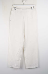 White pants hanging on a white background