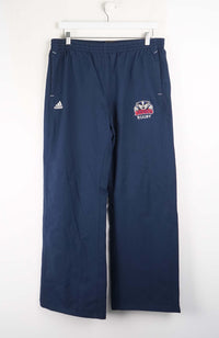 Navy blue rugby pants with a logo and Adidas branding on a white background