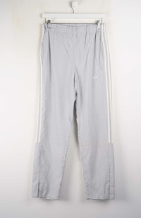Light gray pants with white stripes on a white background