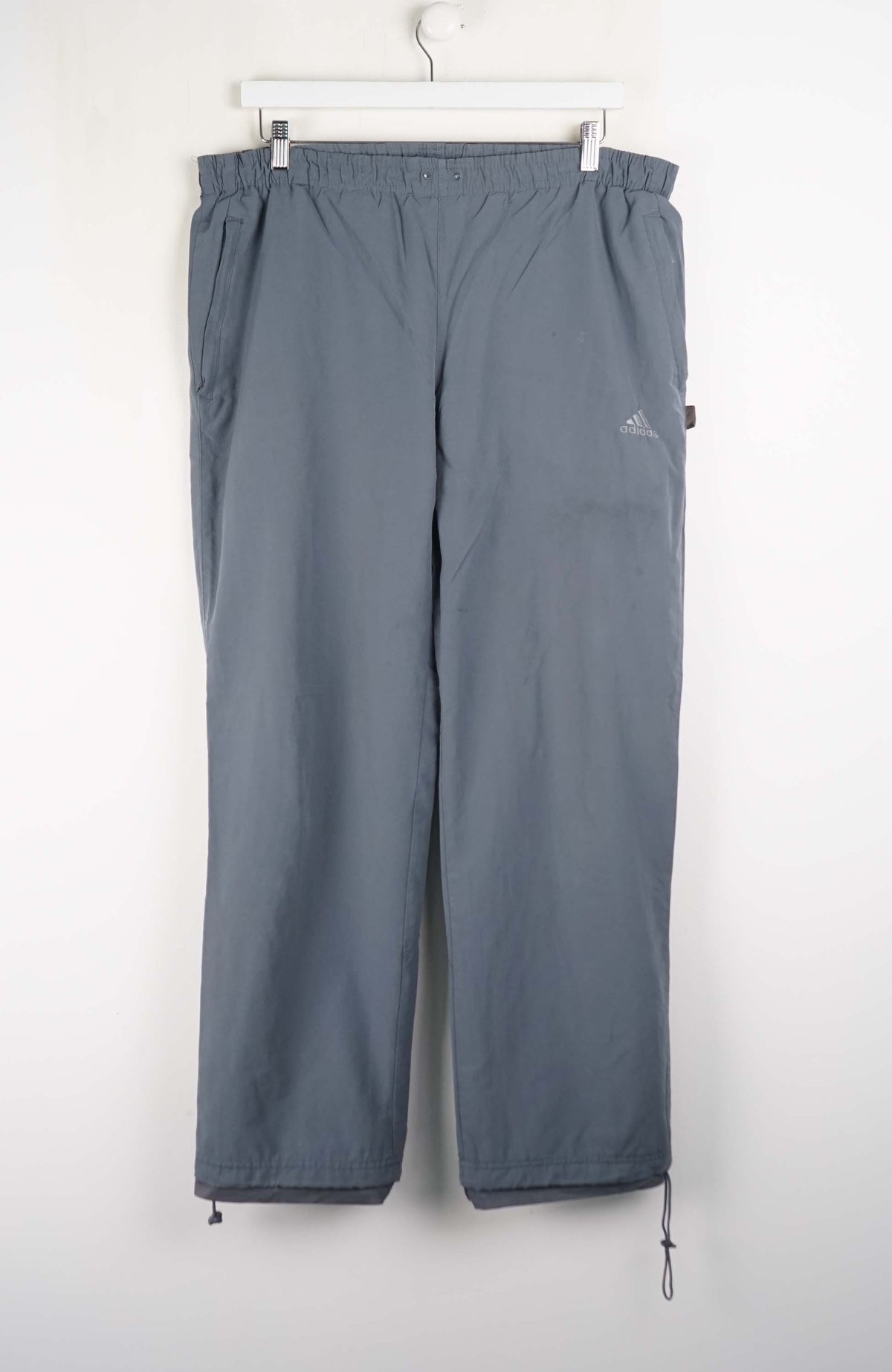 Gray pants with a brand logo on a white background