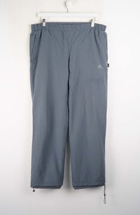 Gray pants with a brand logo on a white background
