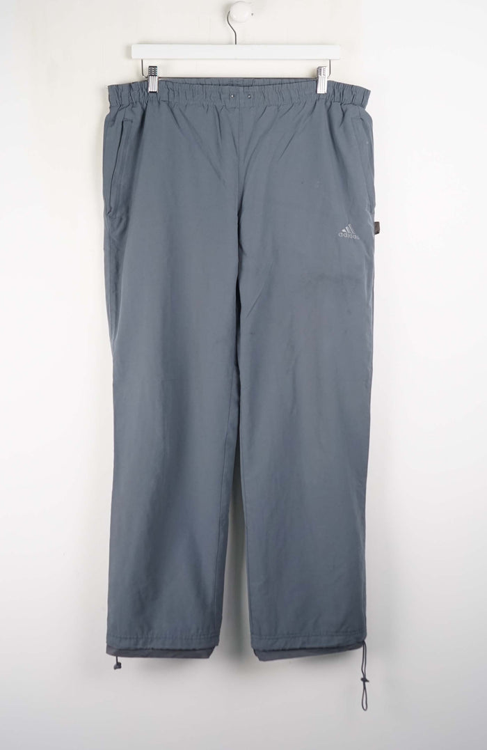 Gray pants with a brand logo on a white background