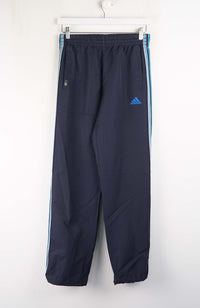 Navy blue Adidas tracksuit pants with white background