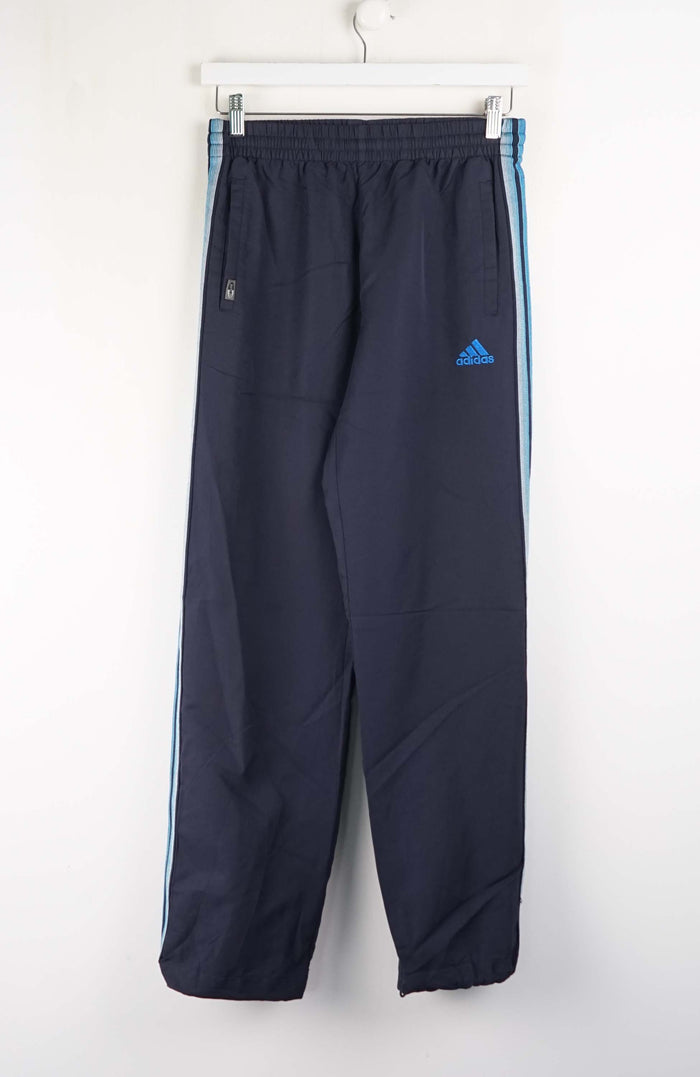 Navy blue Adidas tracksuit pants with white background