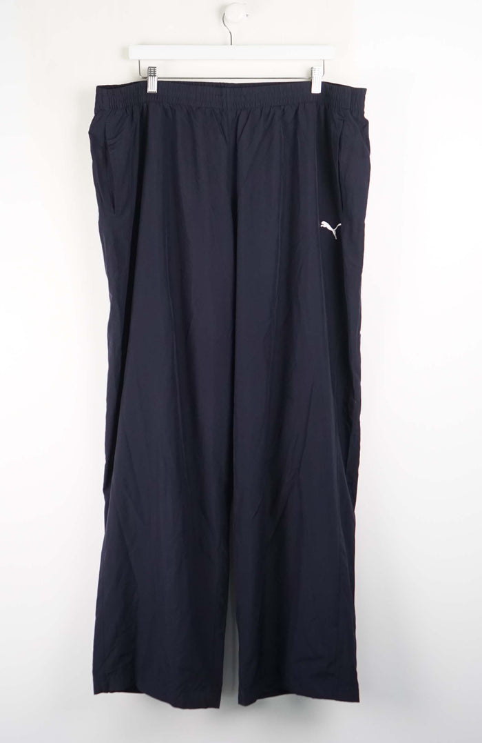 Black pants with a brand logo on a white background