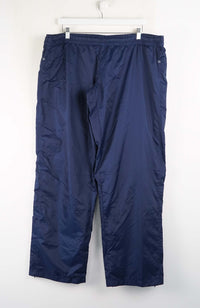 Blue pants hanging on a white background