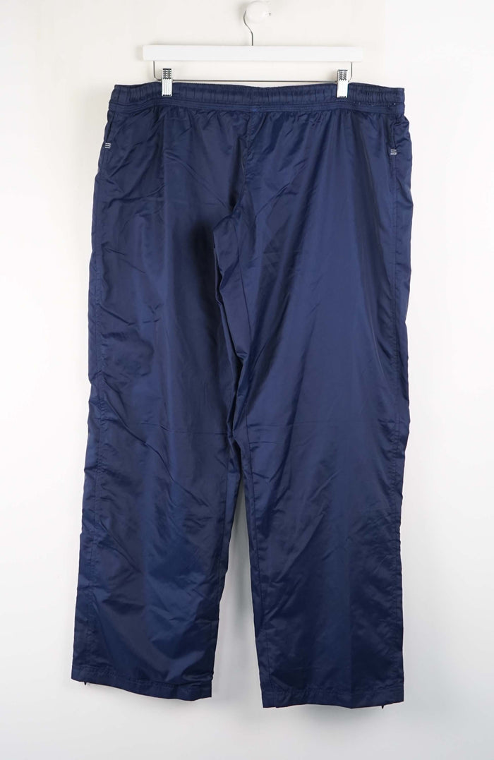 Blue pants hanging on a white background