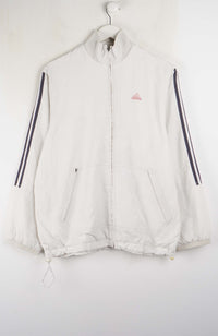 White jacket with black stripes on sleeves hanging on a white background