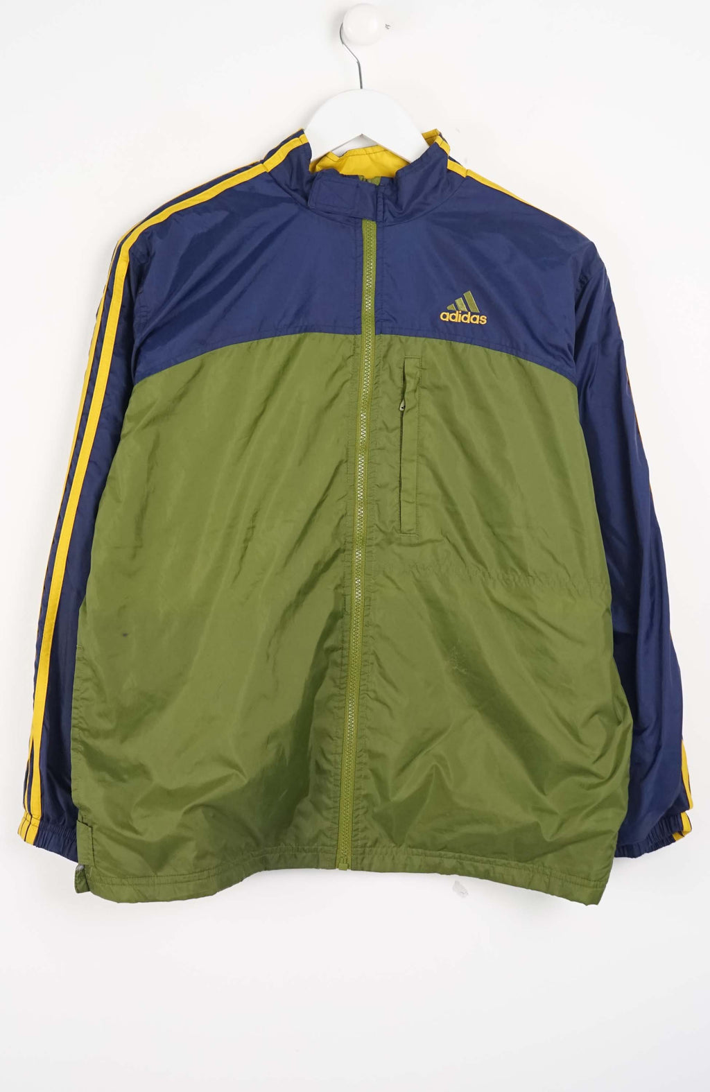 Green and blue jacket with Adidas logo on a white background