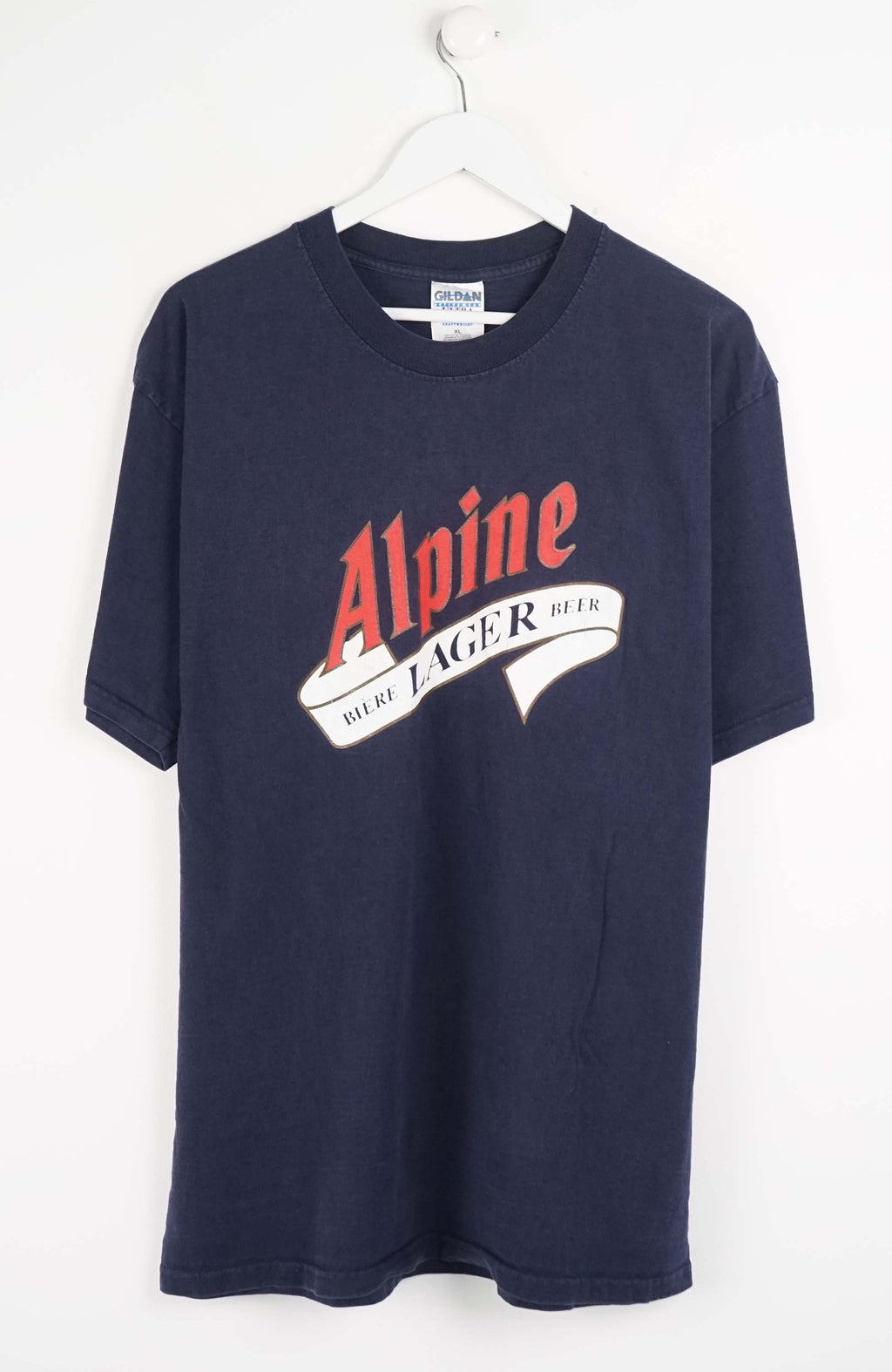 Navy blue t-shirt with red and white logo on a white background