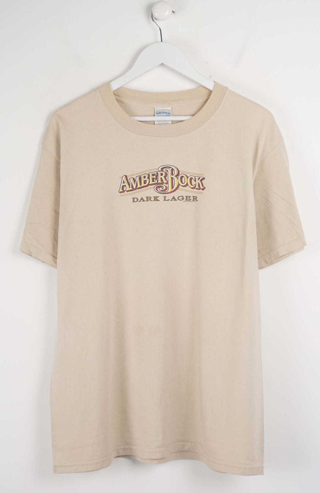 Beige t-shirt with 'Amberock Dark Lager' text on a white background