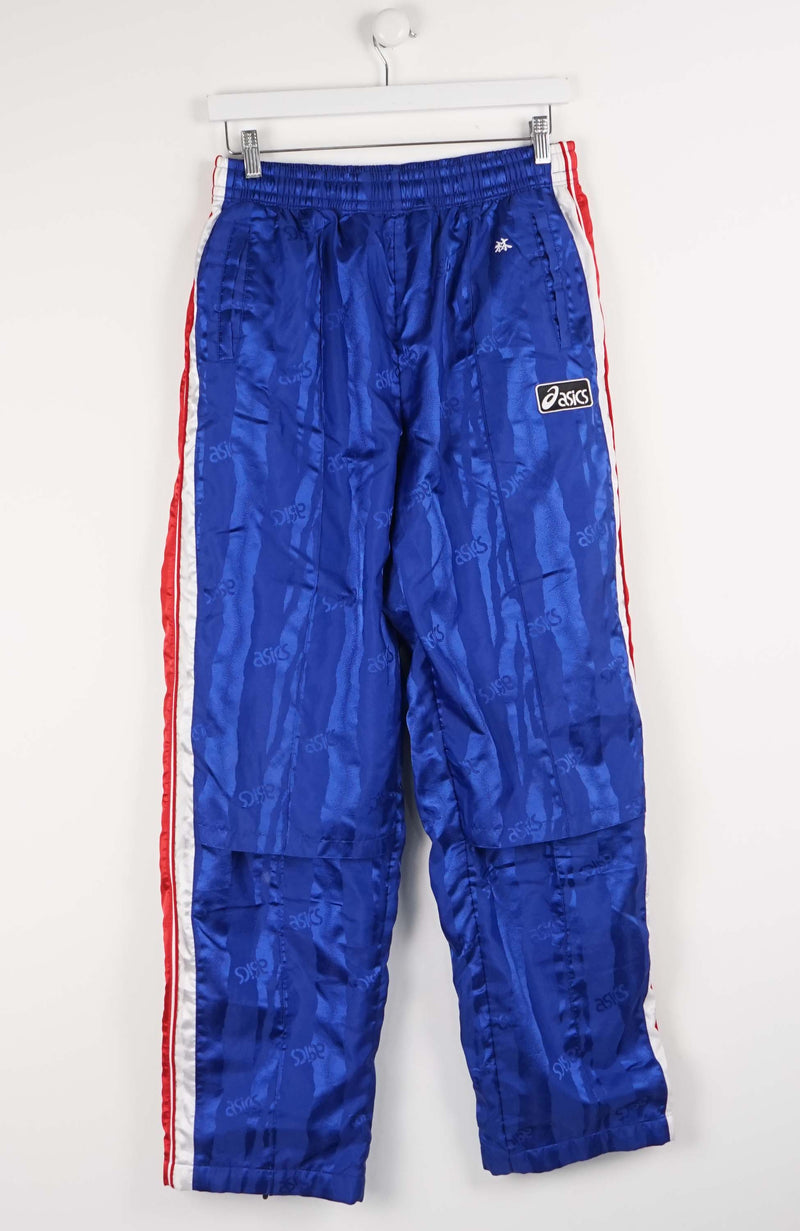 Blue track pants with red and white stripes on a white background