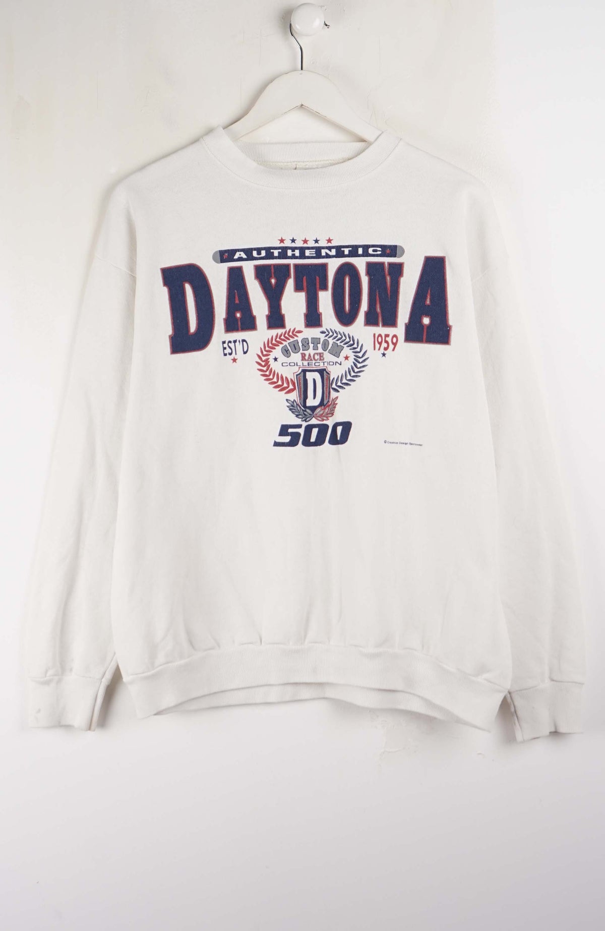 White sweatshirt with 'Daytona' and '500' text on a white background