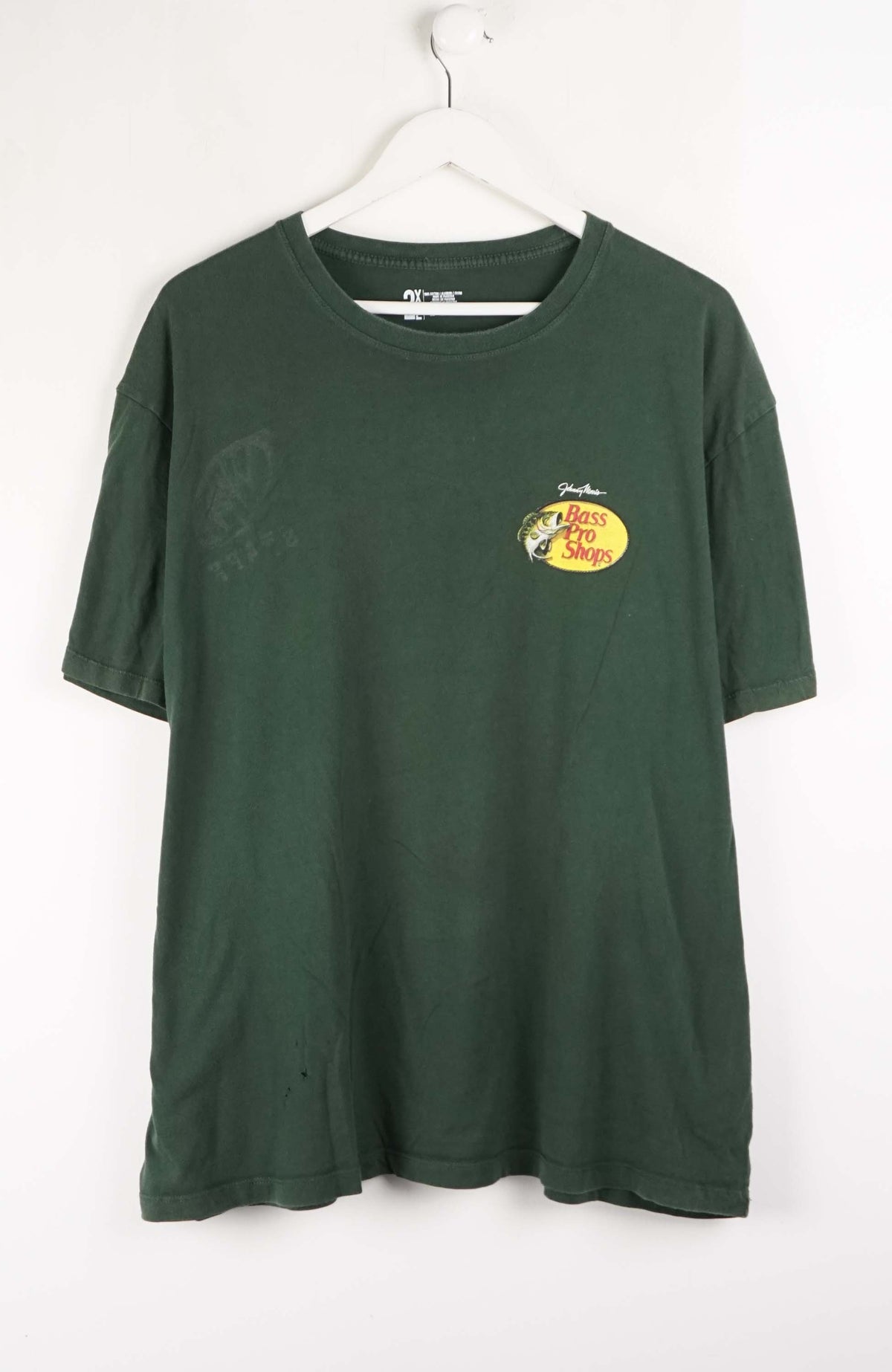 Green t-shirt with a small logo on a white background