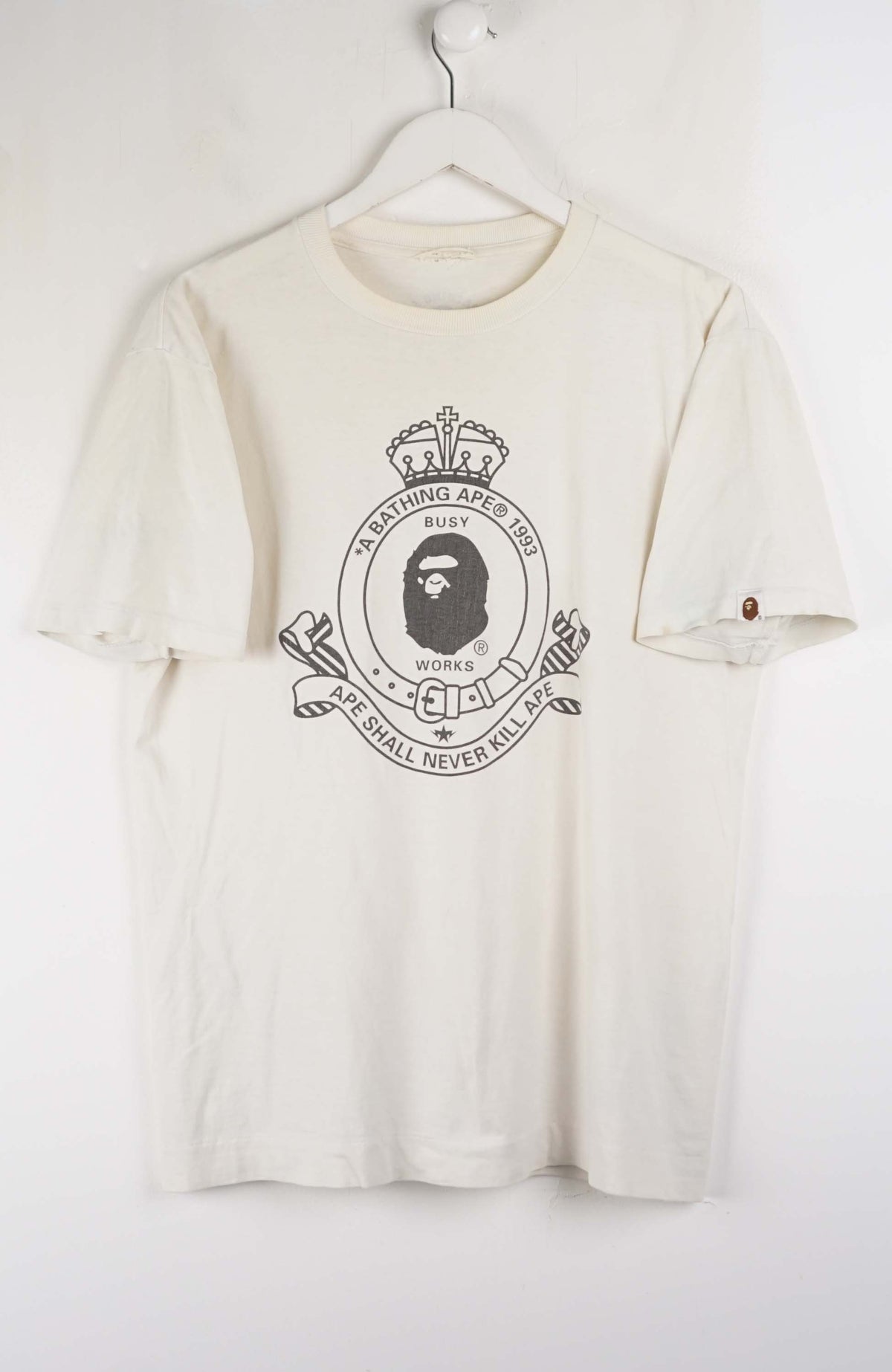White t-shirt with a logo on a white background