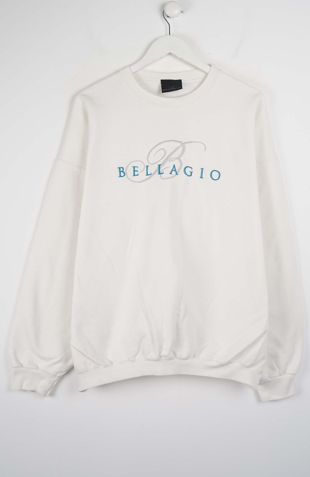 White sweatshirt with 'Bellagio' logo on a white background
