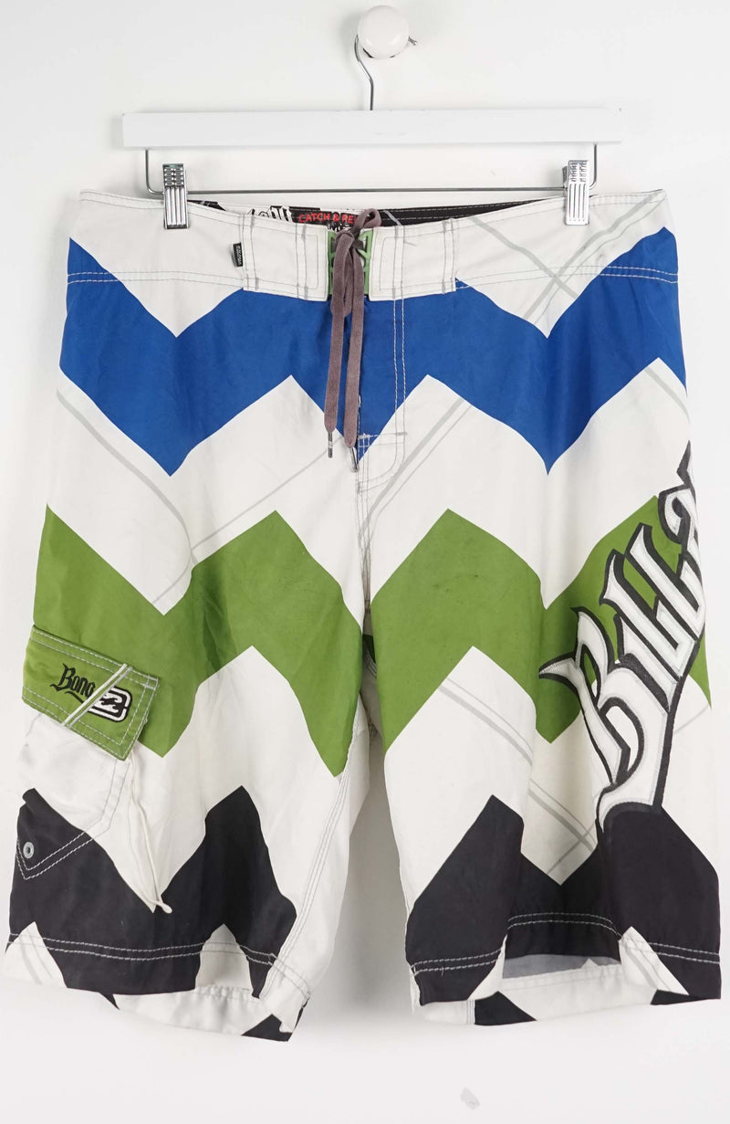Colorful zigzag patterned shorts on a white background