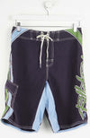 Black board shorts with blue and green accents on a white background
