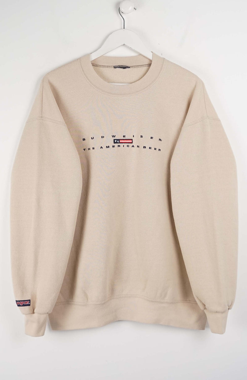 Beige sweatshirt with branding on a white background