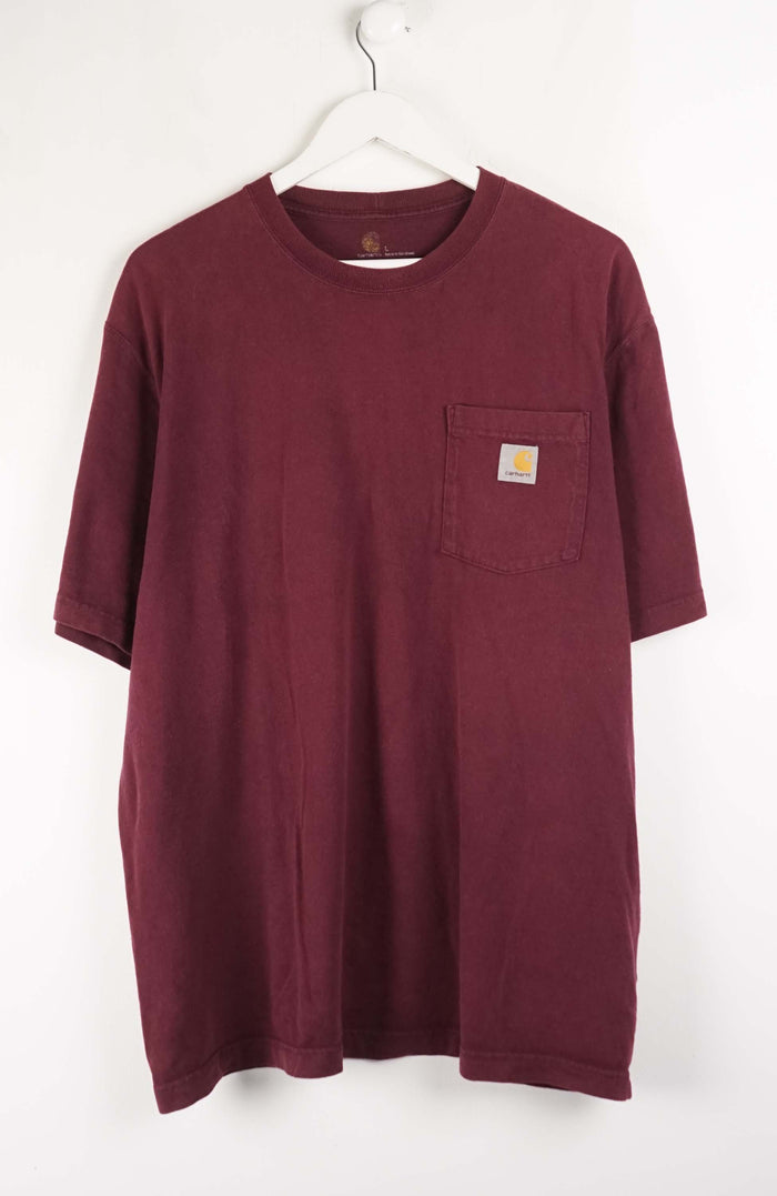 Maroon t-shirt with a pocket on a white hanger against a white background