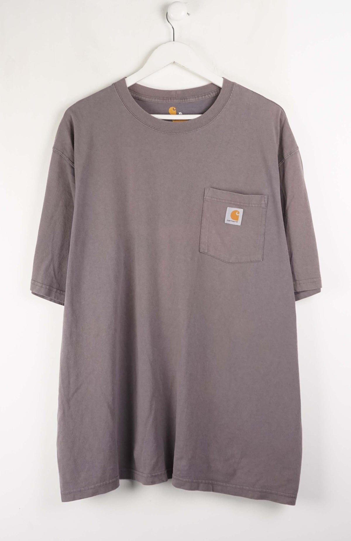 Gray t-shirt with a pocket on a white background