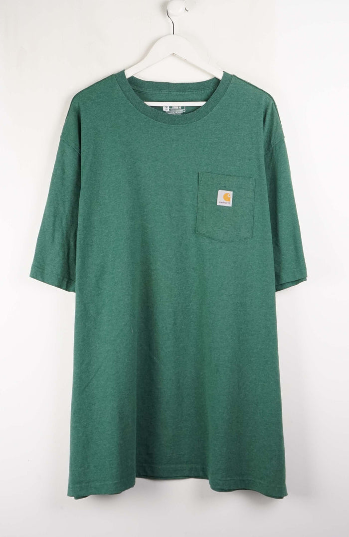 Green t-shirt with a pocket on a white background