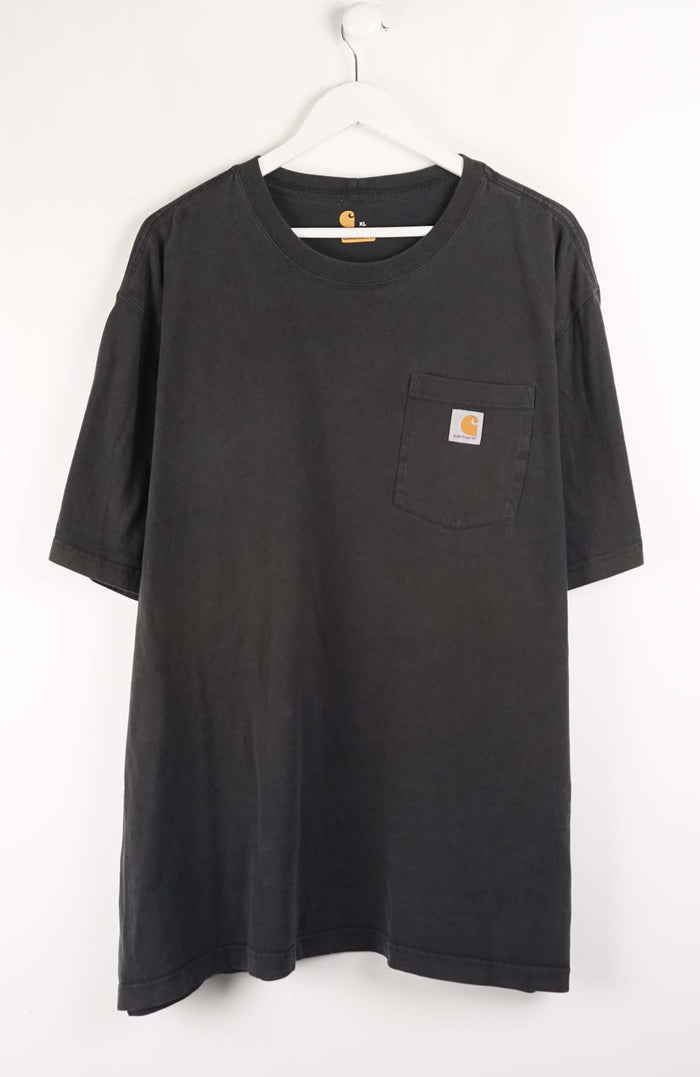 Black t-shirt with a pocket and Carhartt logo on a white background