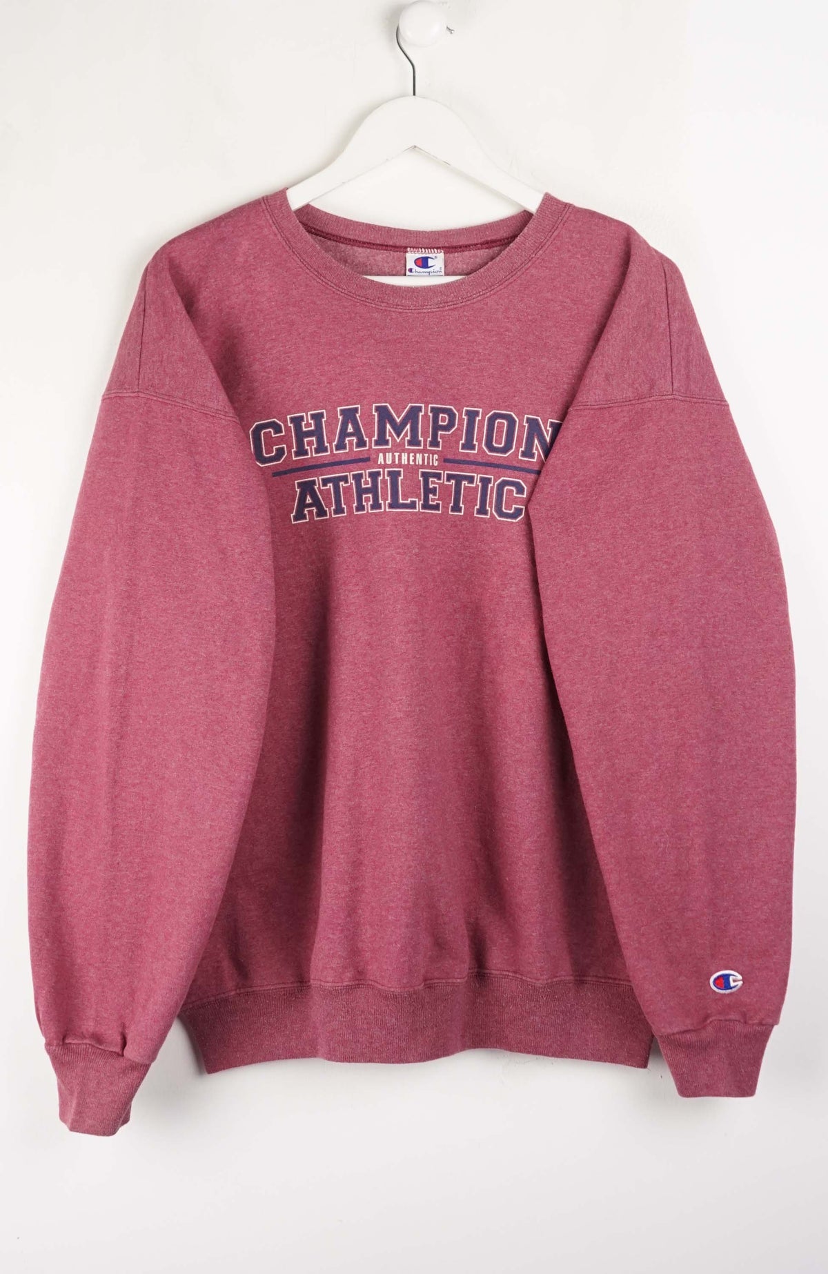 Maroon sweatshirt with 'Champion Athletic' text on a white background
