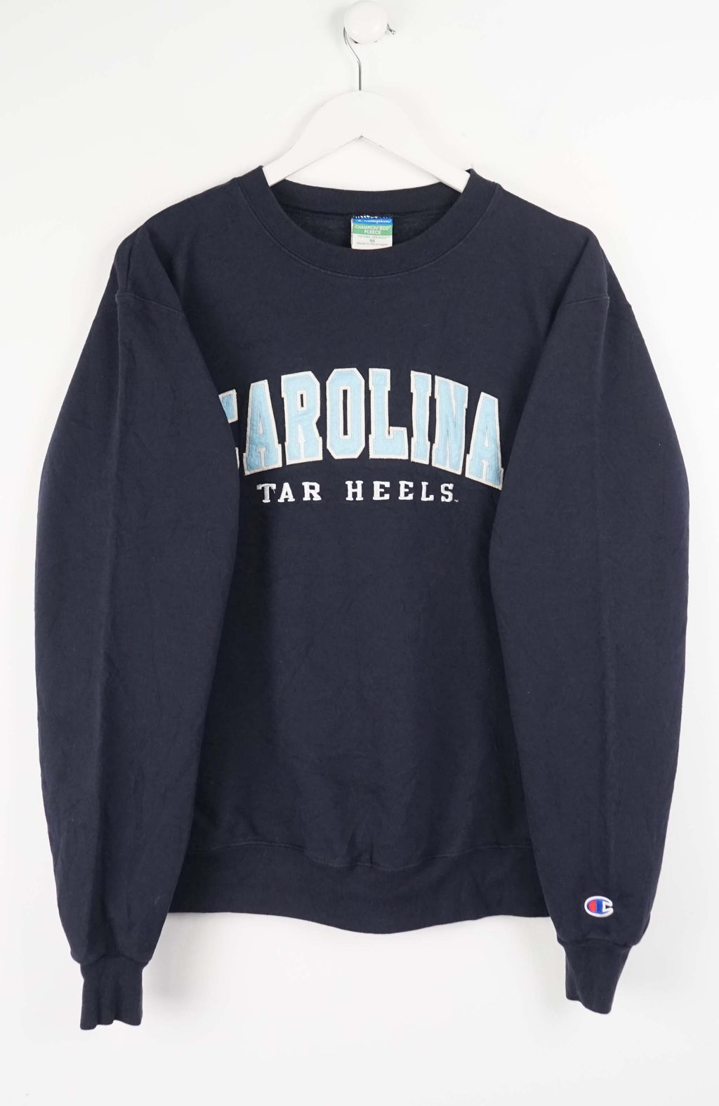 Navy blue sweatshirt with 'Carolina Tar Heels' text on a white background
