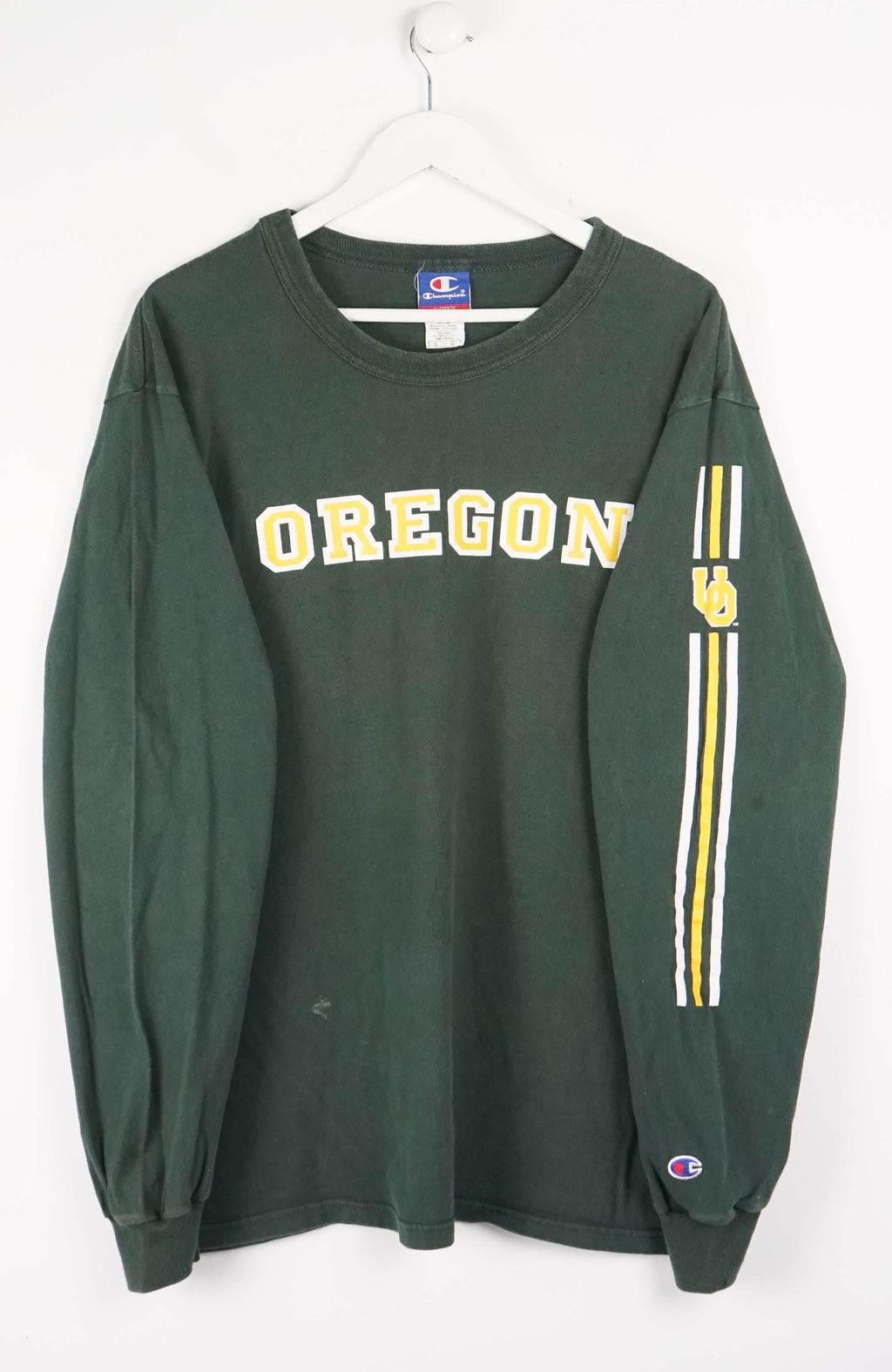 Green long-sleeve shirt with 'OREGON' text and Champion logo on a white background