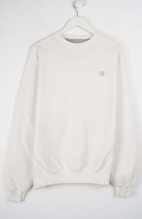 White sweatshirt on a hanger against a white background