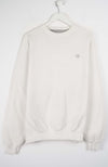 White sweatshirt on a hanger against a white background